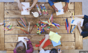 Ariel View of Kids sitting at a table crafting